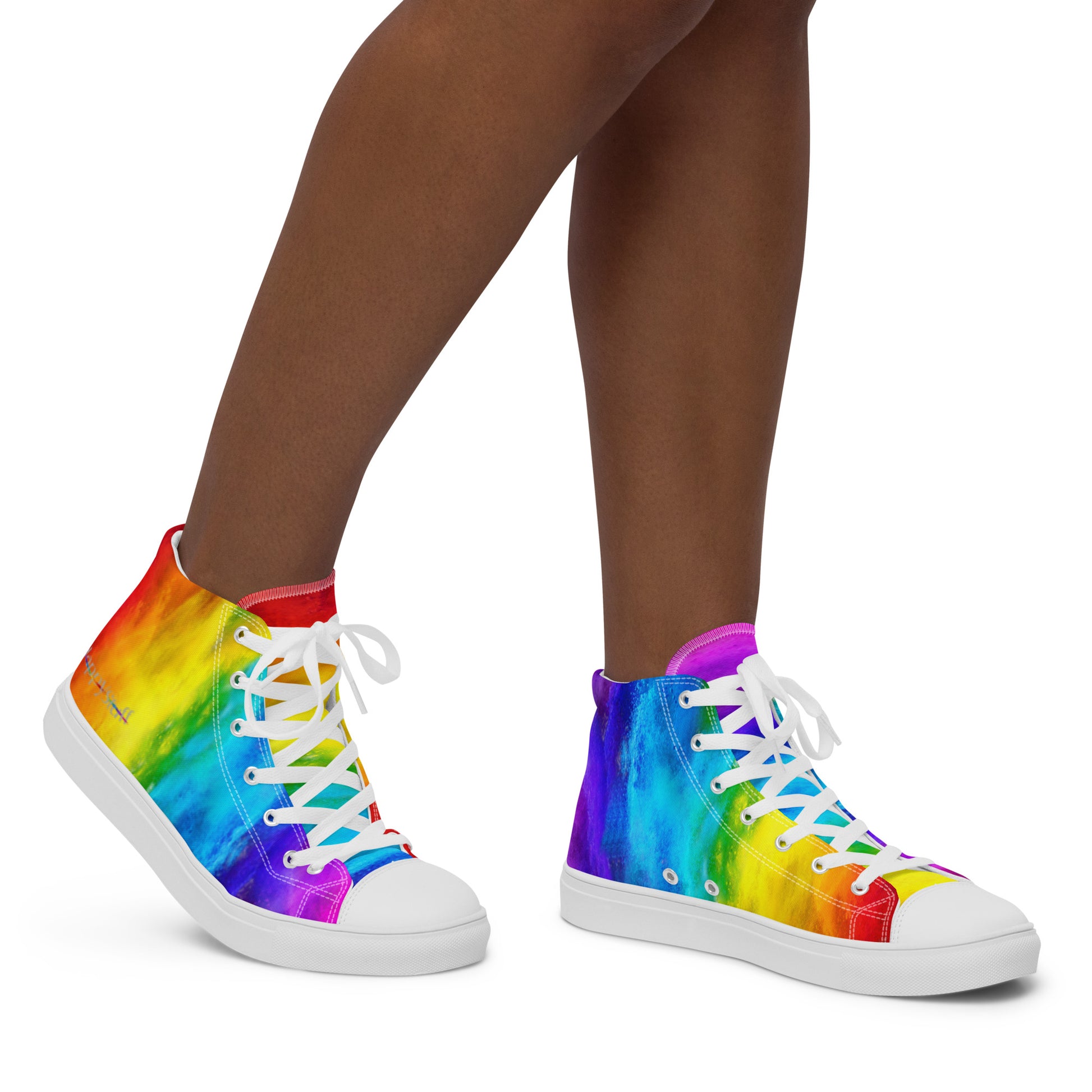 Close up of rainbow shoes on a woman walking right holi colours printed on white high tops HappyStuff sneakers fun shoes