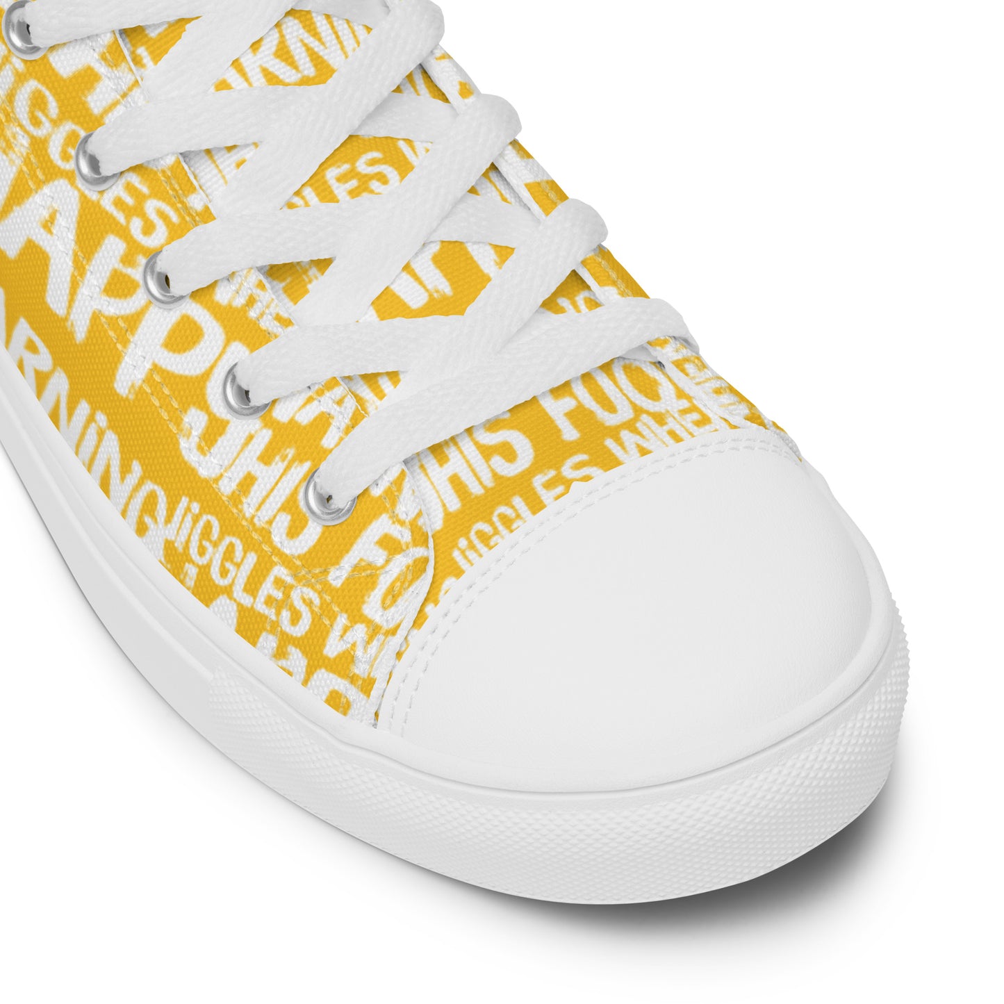 HappyStuff yellow high tops with playful white print Warning This Foot Jiggles When Happy white laces faux leather toe cap closeup