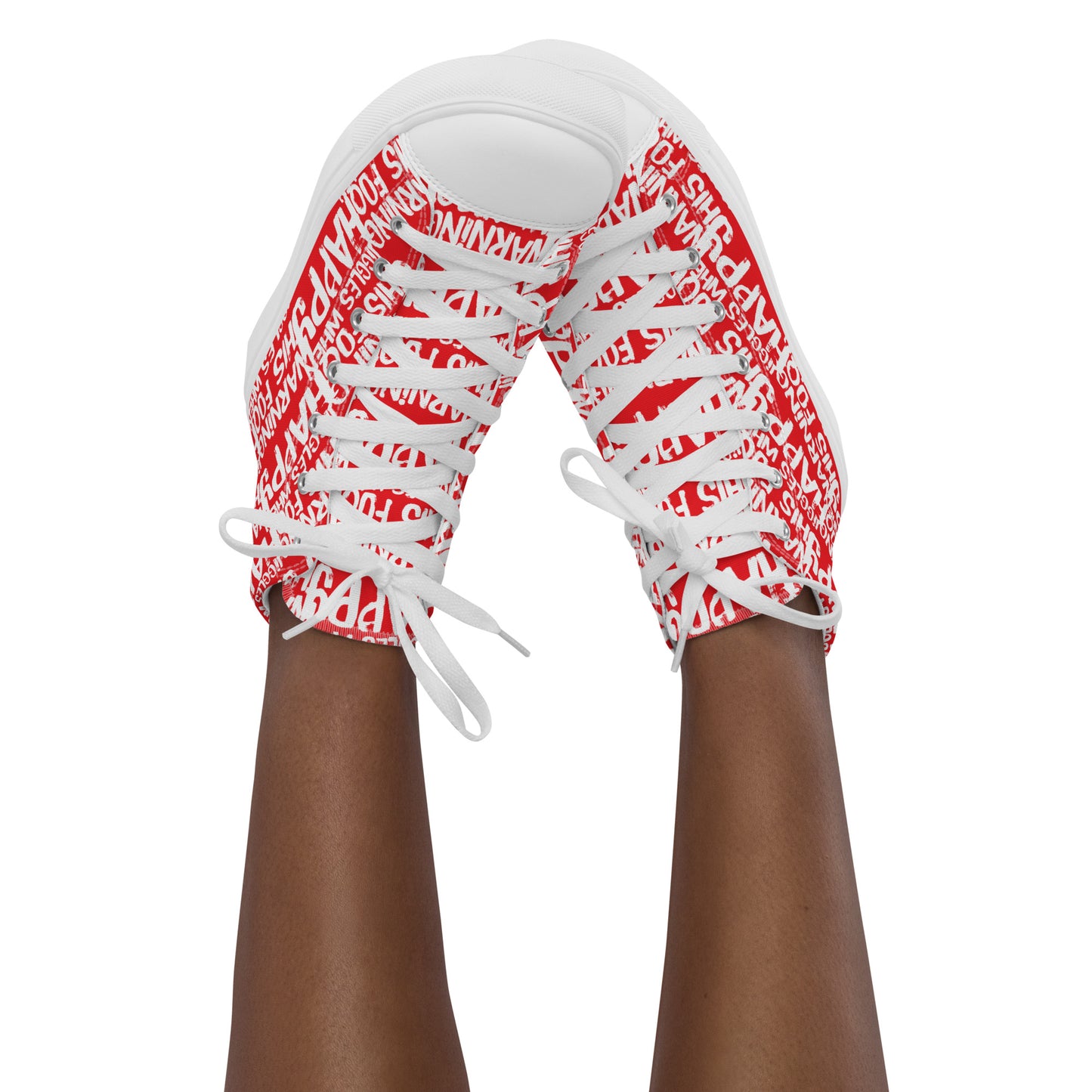 Womans feet in the air tapping toes of her high tops playful red and white print Warning This Foot Jiggles When Happy