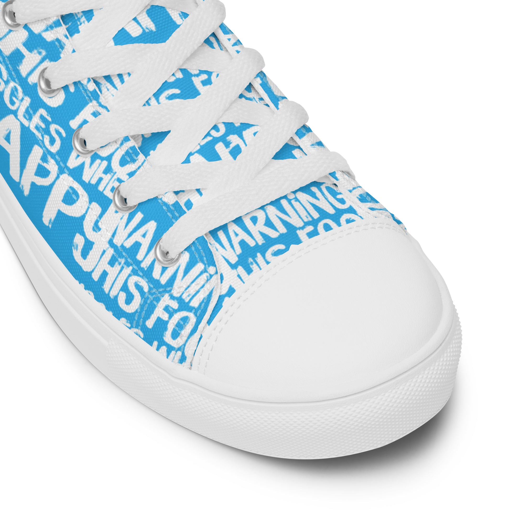 HappyStuff blue high tops with playful white print Warning This Foot Jiggles When Happy white laces faux leather toe cap closeup